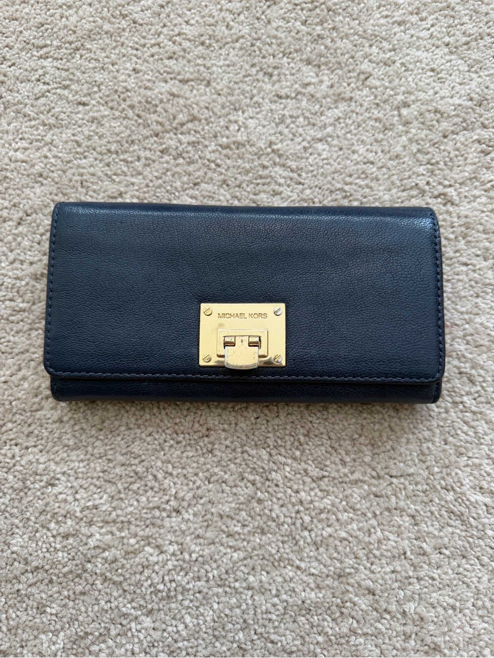 Michael Kors navy blue wallet featuring a gold-tone push-lock large wallet